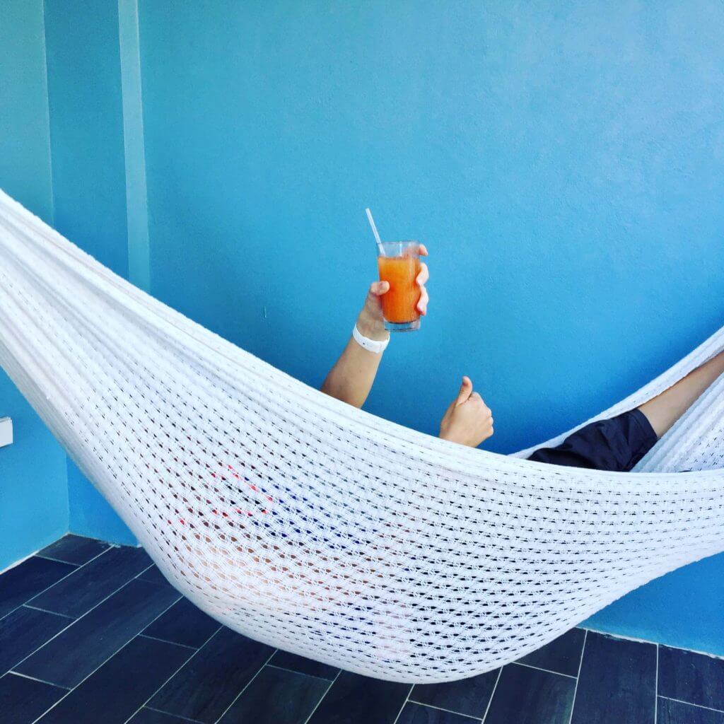 Brooke in the hammock with a drink