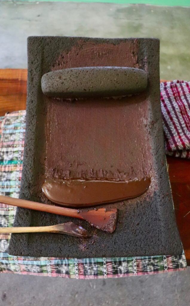 Cacao paste on grinding stone