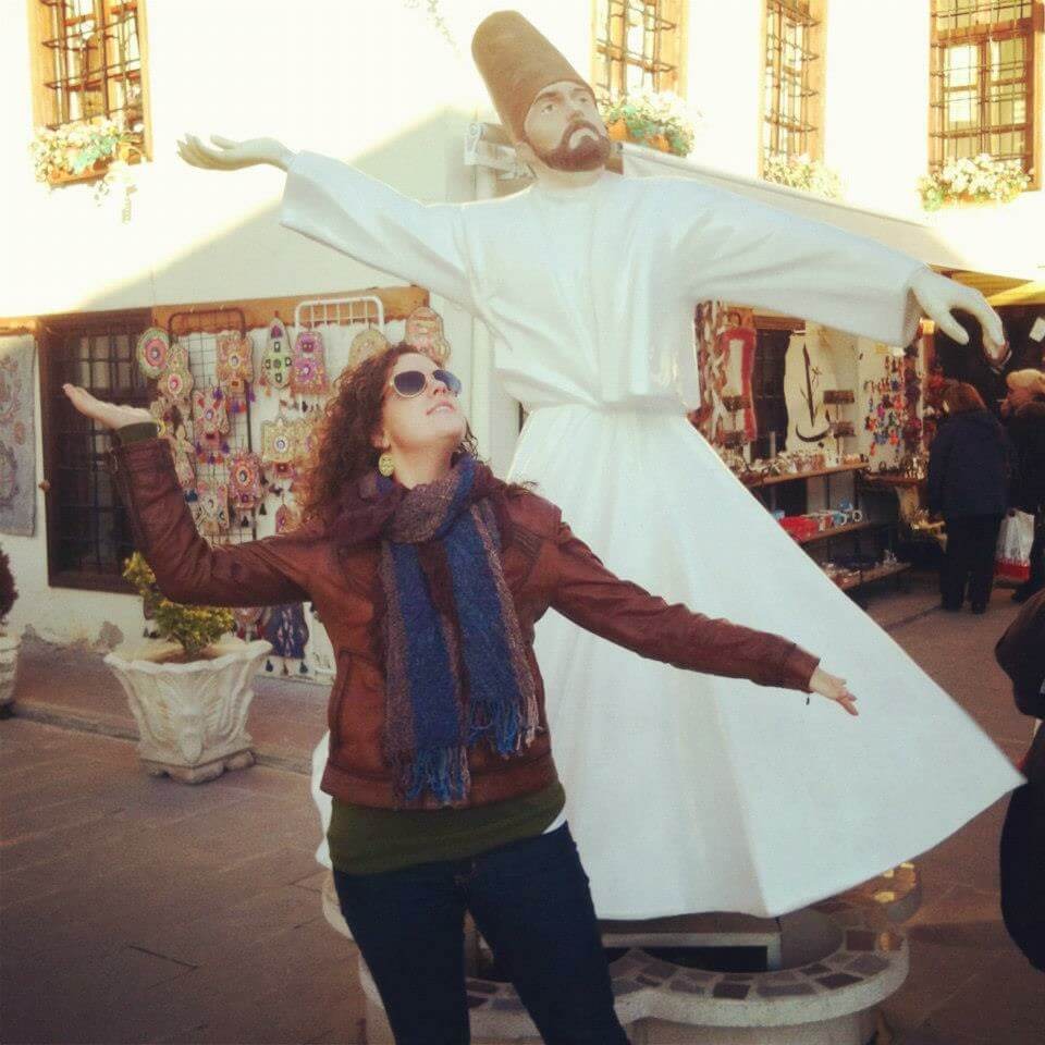 Emily emulating a whirling dervish statue