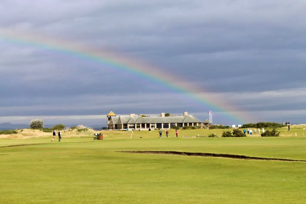 Rainbow over the Links Clubhouse with greens in the foreground