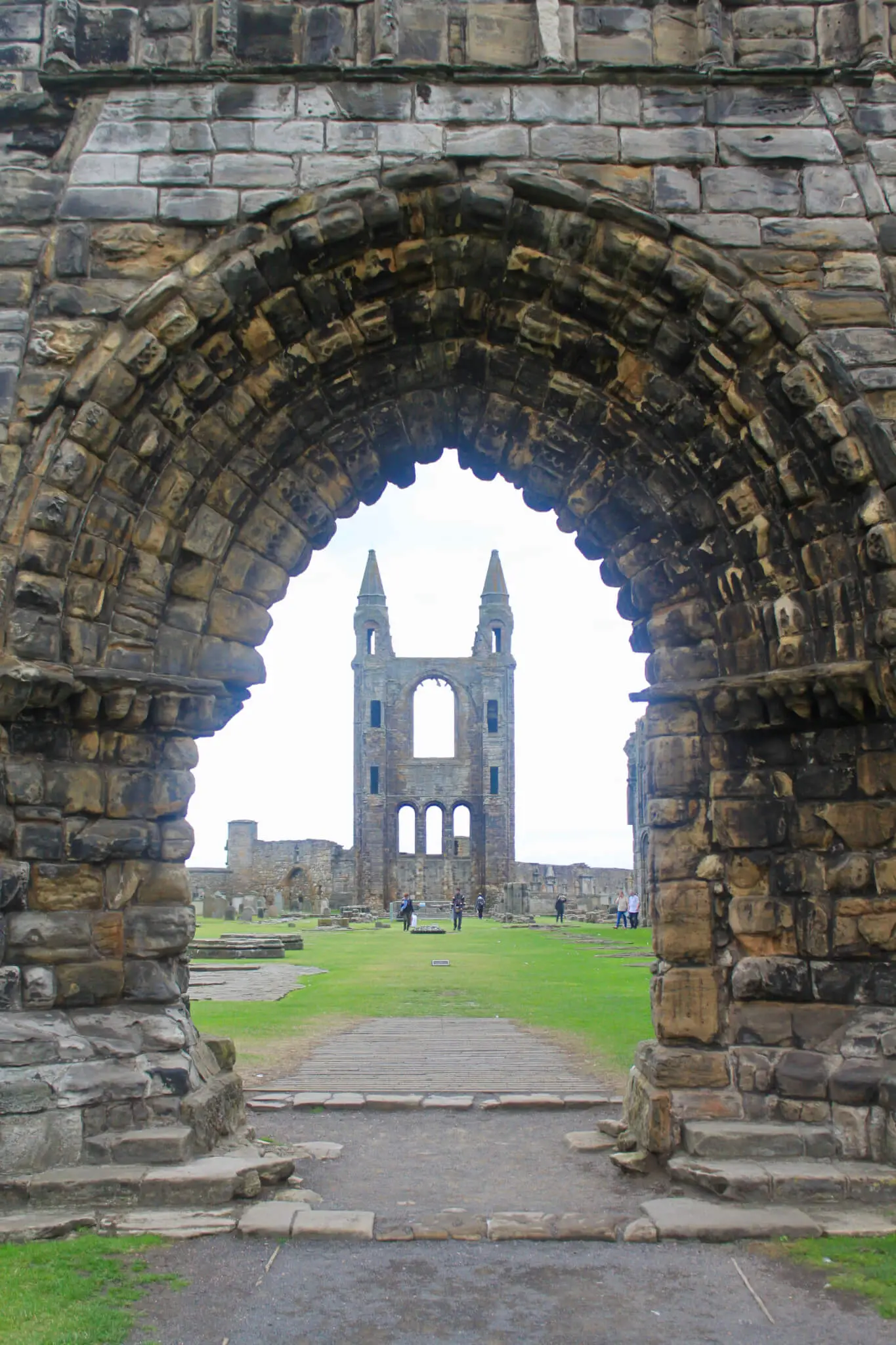 View of ruined towers of St. Andrews Cathedral as seen through open entryway in other ruins