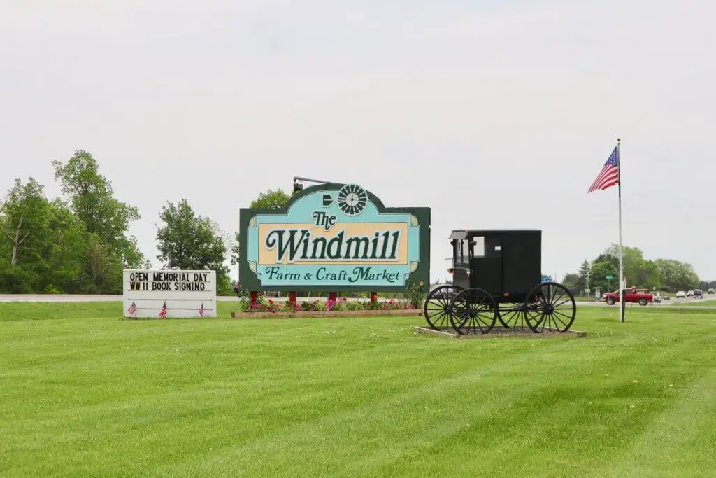 Sign for The Windmill, with buggy. Antiquing is a great pastime for your weekend getaway in the Finger Lakes.