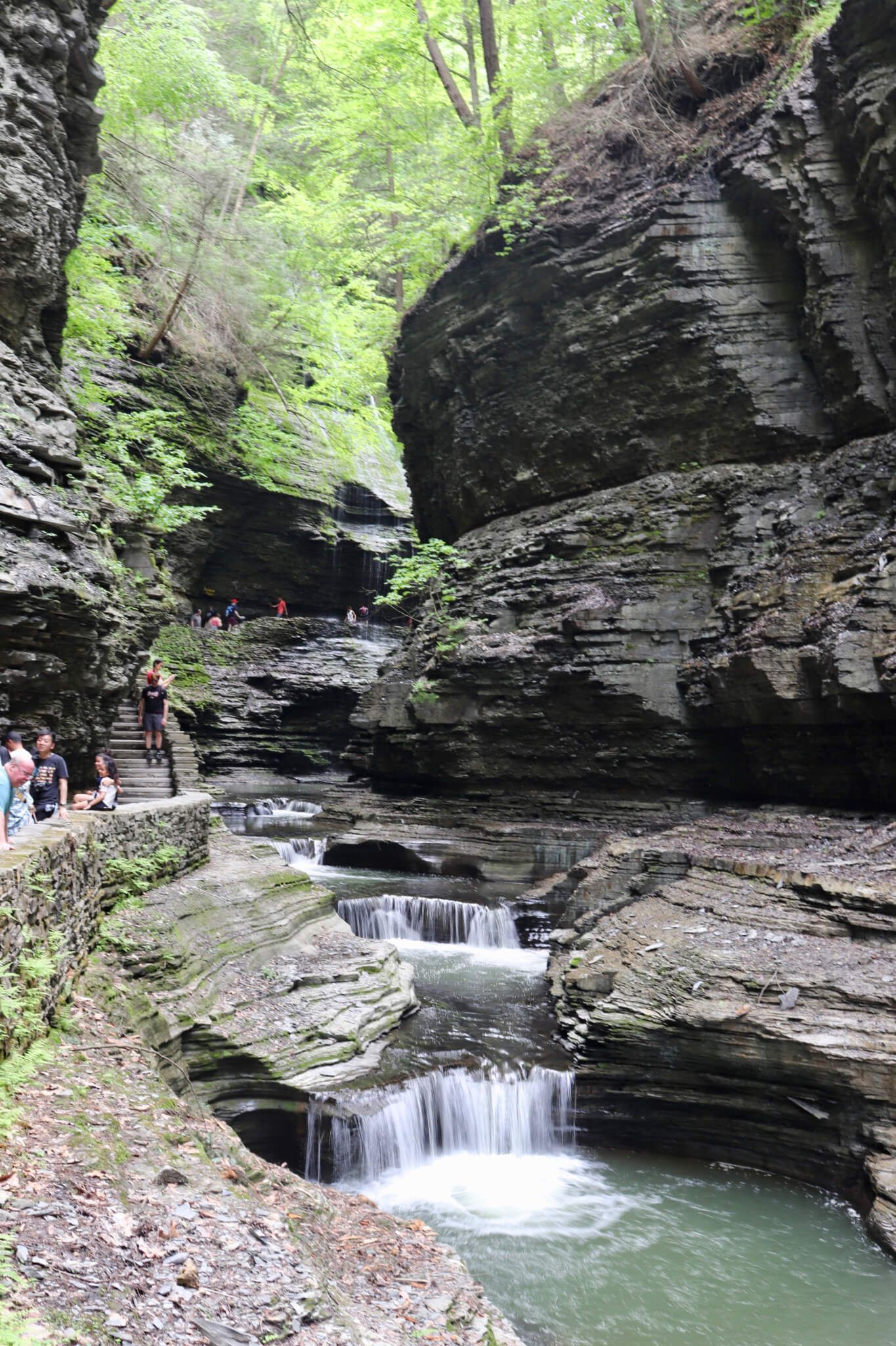 Rocky stairs, cliffs, and small waterfalls.