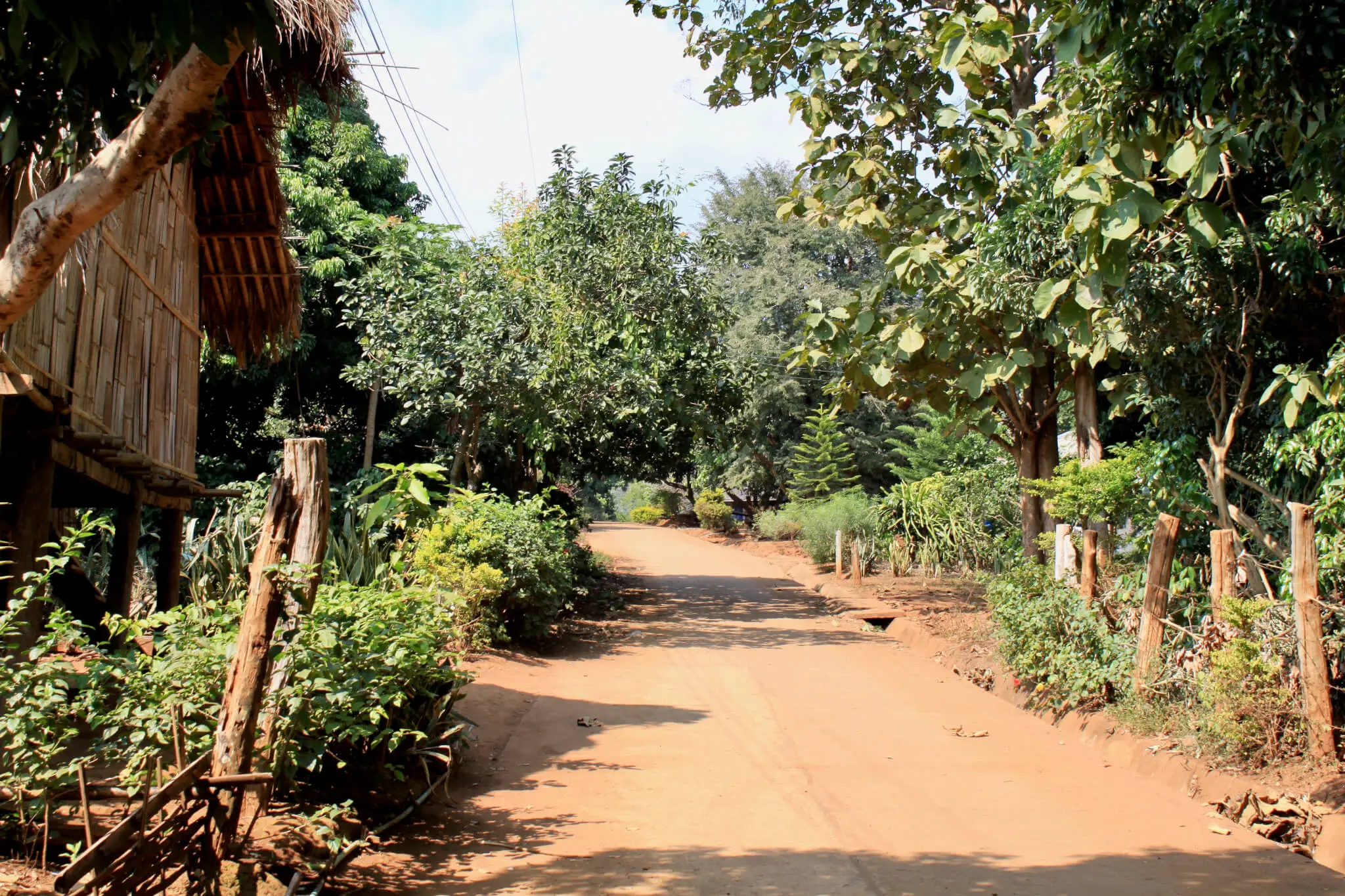 Dirt path through a village in rural Thailand