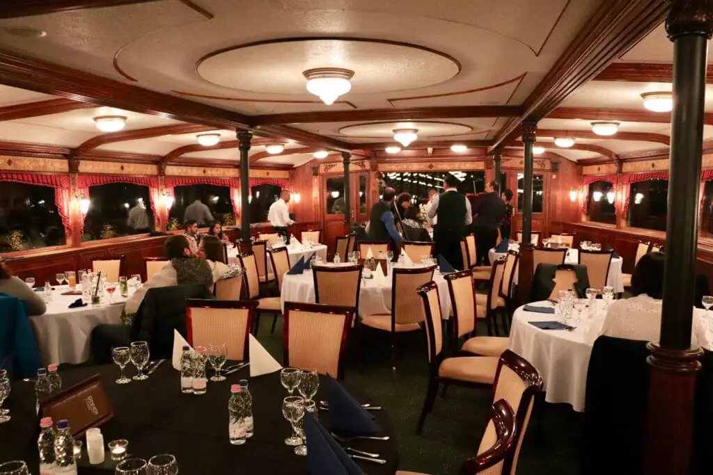 Tables and patrons on the dinner cruise