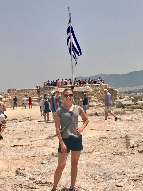 Ellen in front of Greek flag and Acropolis