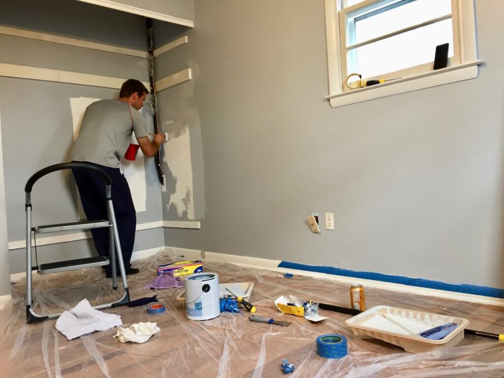 M painting the baby's room walls gray