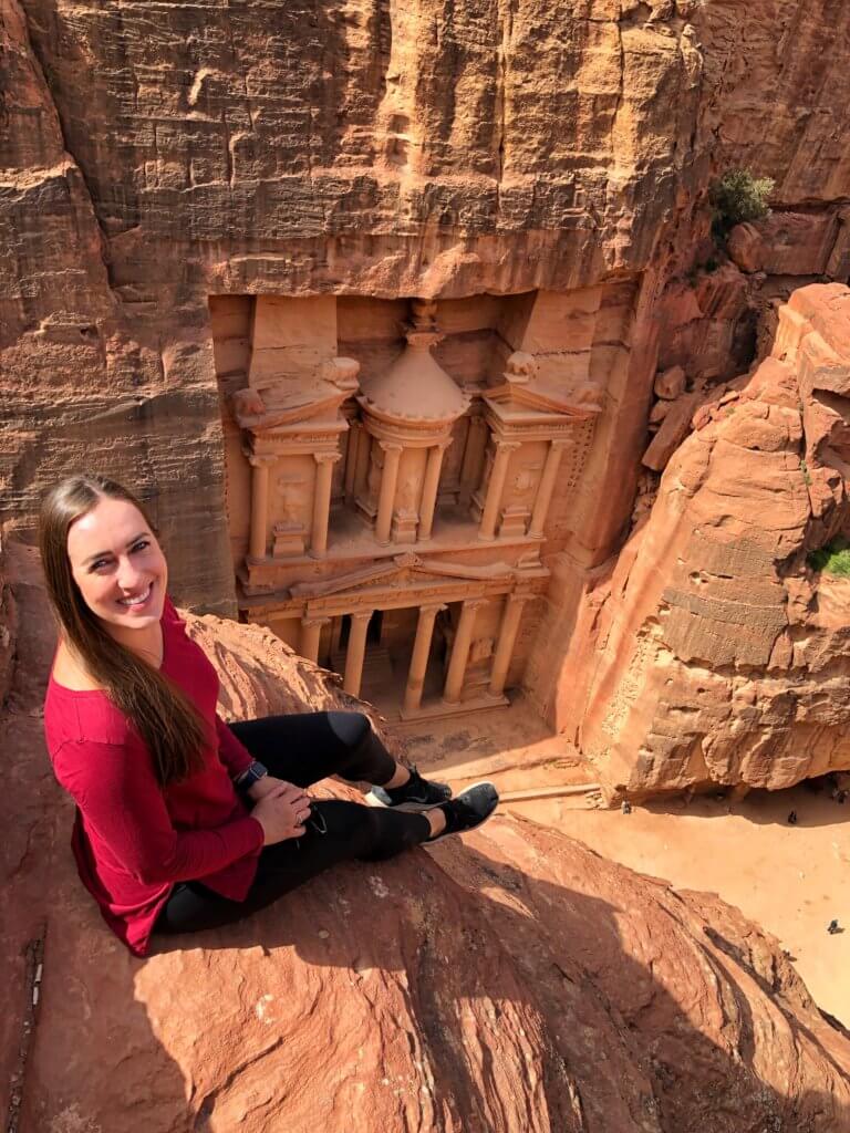 Michelle sitting above Petra in Jordan