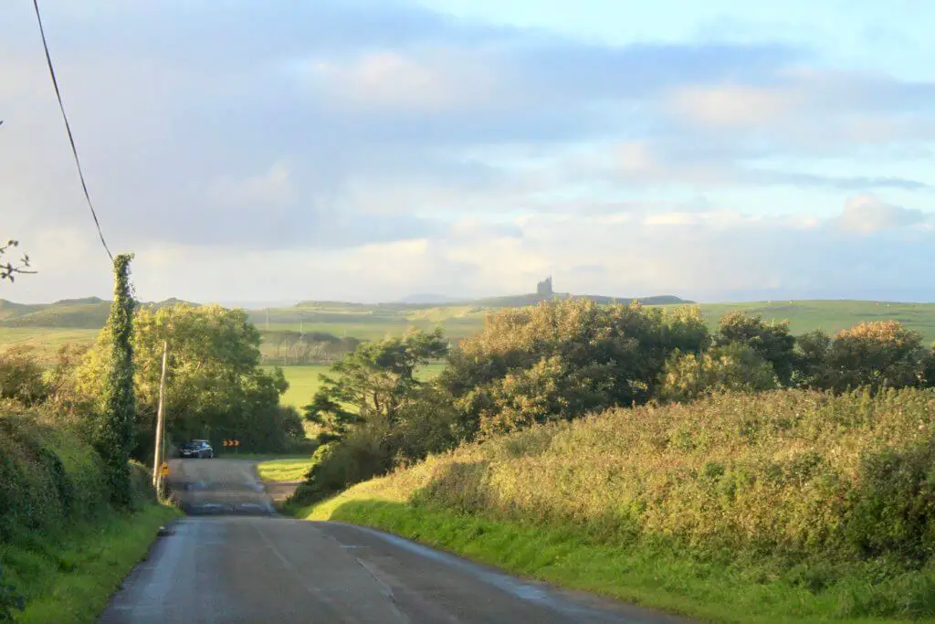 Country road and castle in the distance on the Mullaghmore Peninsula
