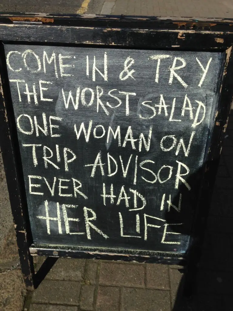 Sign reading "Come in and try the worst salad one woman on TripAdvisor ever had in her life"