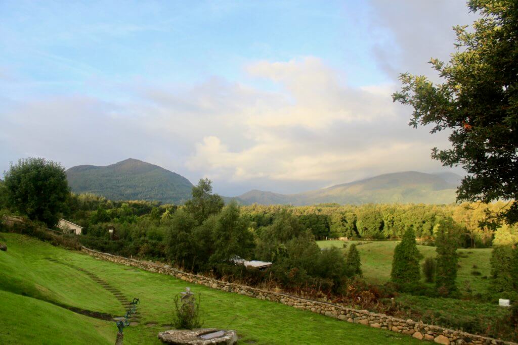 View from the porch of Frank's place, with green mountains and trees