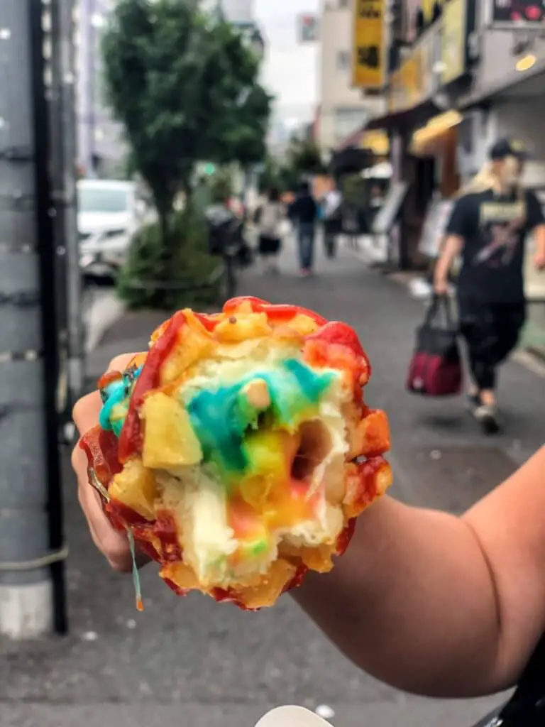 Cheesy snack in rainbow colors. For many, kawaii food is top of the list of what to eat in Tokyo and Kyoto.