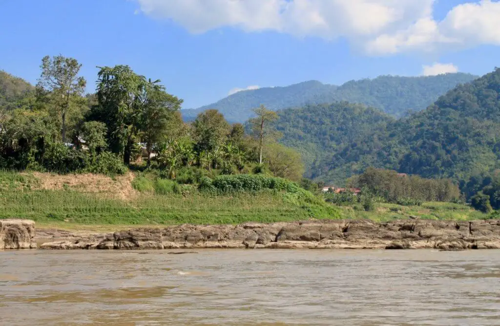 Green hills and mountains seen from the river