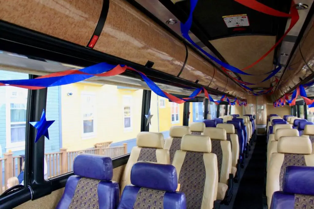Interior of a motor coach bedecked in patriotic streamers and stars