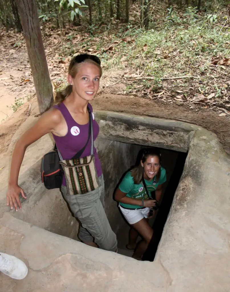 Gwen and Katie prepare to enter the widened Cu Chi tunnels