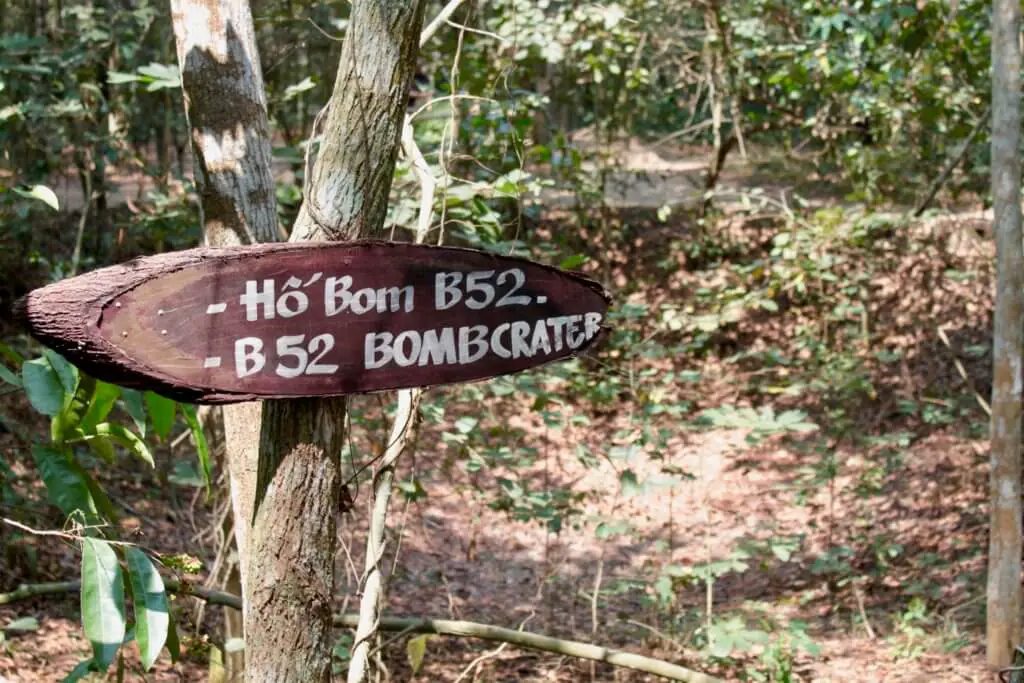 Sign pointing to a bomb crater from a B52 bomber