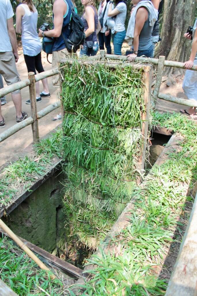 Booby trap disguised as flat grass that opens onto sharpened stakes.