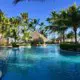 Gorgeous pool and swim-up bar at Dominican Republic resort. Full Life, Full Passport's honeymoon planning service can help you find the best destination!