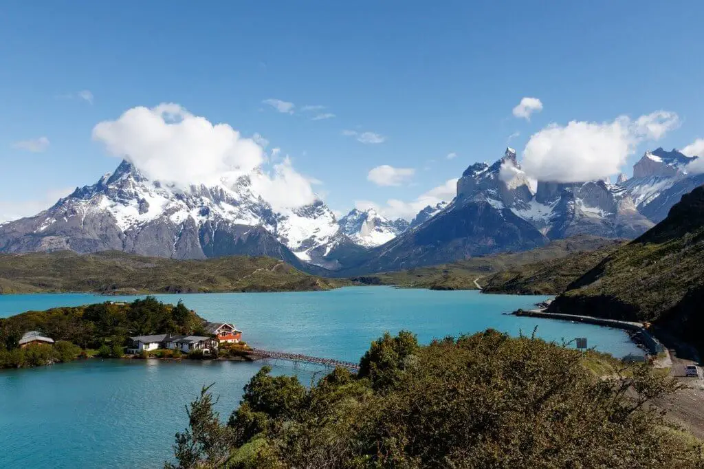 Teal-colored lake and snow-capped mountains in Torres del Paine National Park, Chile