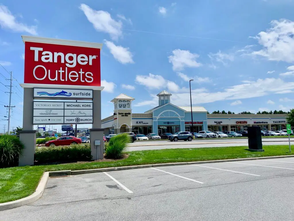 Tanger Outlet sign in front of stores