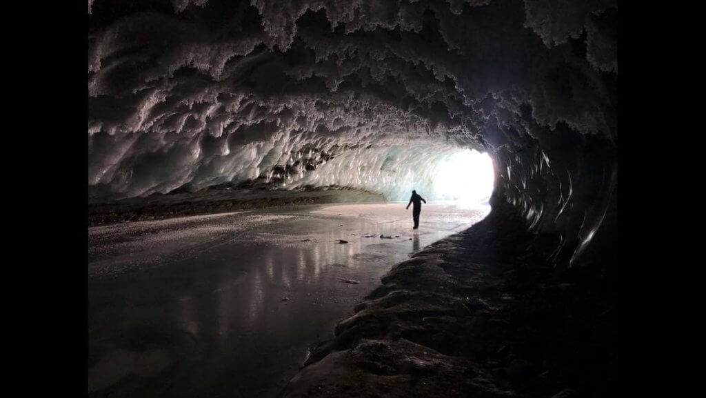 Exploring an Alaskan ice cave while on assignment