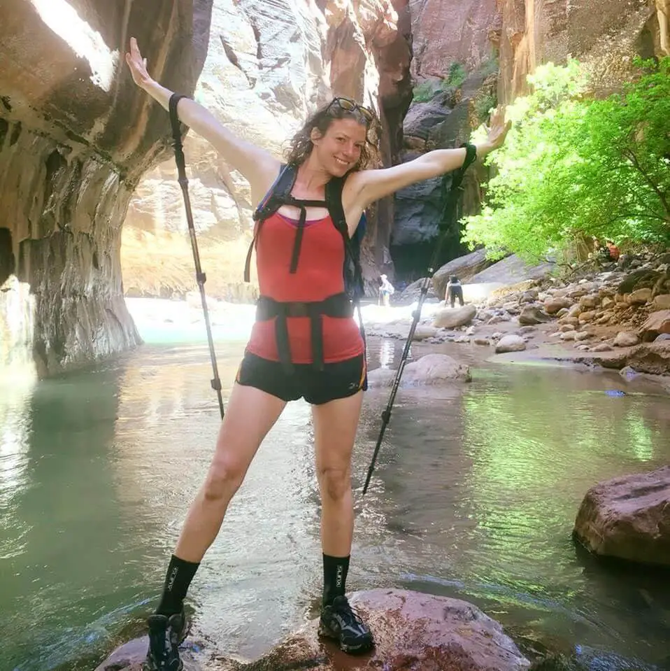 Megan with hiking poles in a canyon in the American Southwest