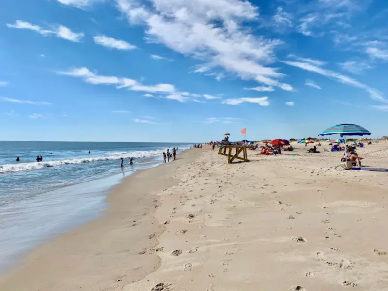 Blue sky over the beach at Delaware Seashore State Park, one of the best things to do in Rehoboth Beach Delaware