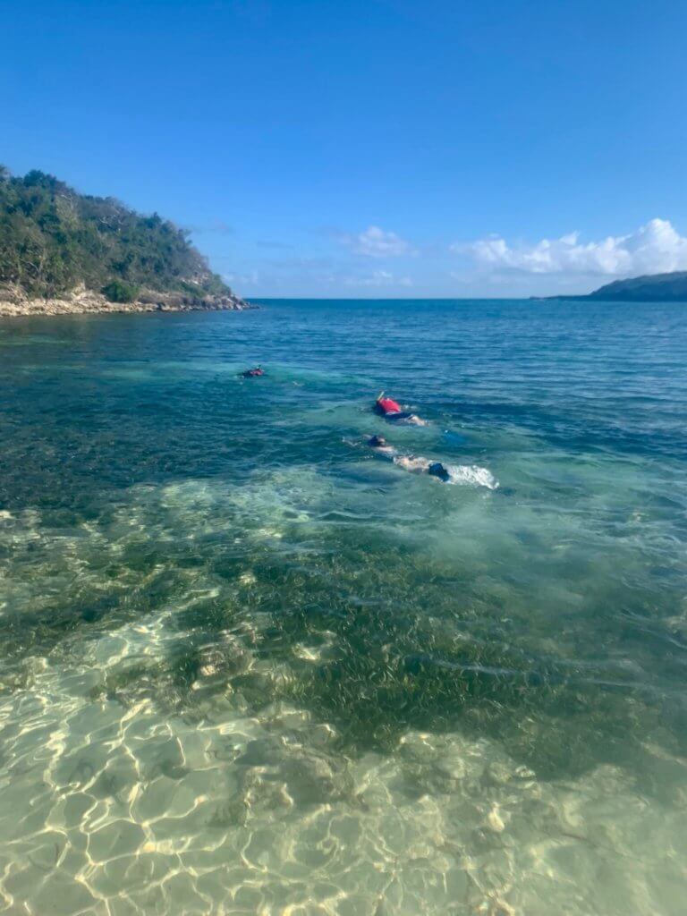 AB, Mom, and Gwen swimming away on their snorkel adventure