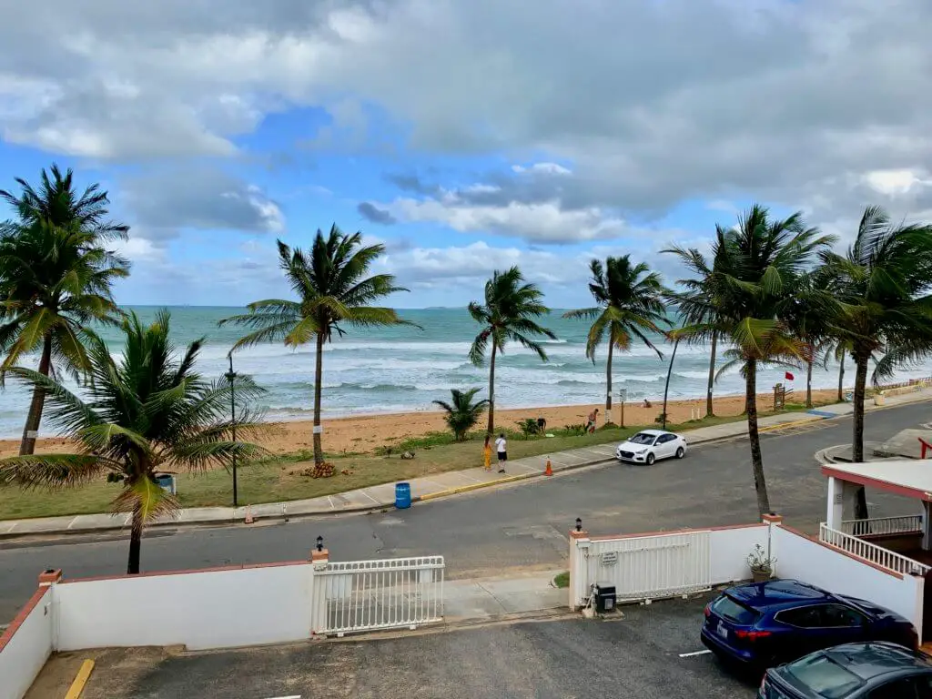 View of beach and palm trees from Luquillo Sunrise Hotel