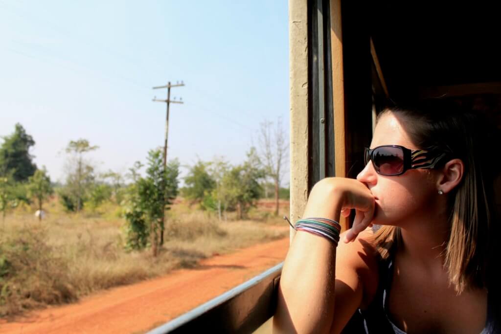 Katie staring out the open train window