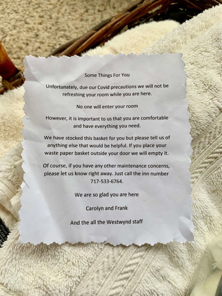 Note from innkeepers stating that they won't be entering the room but to enjoy the basket