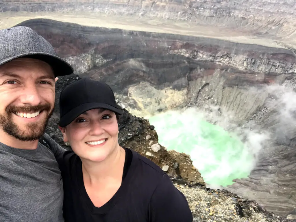 Max and a friend in front of a volcanic crater in El Salvador