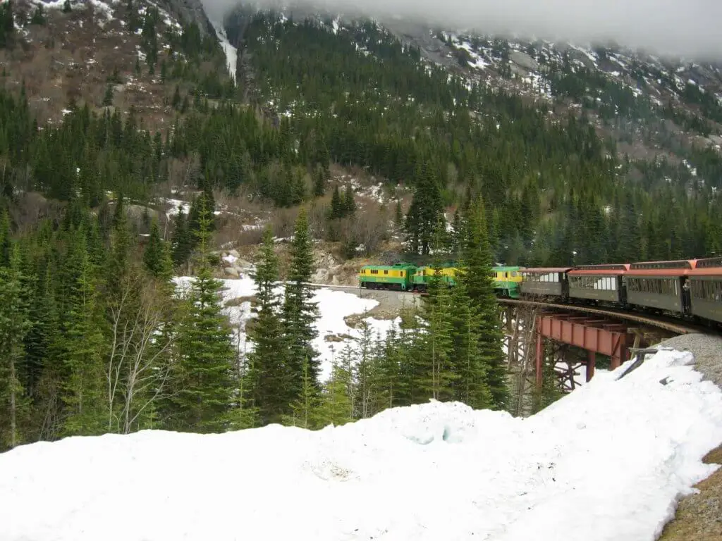 The White Pass & Yukon Route train winding its way up the snowy White Pass. Not only is the WPYR on Alaska bucket lists, but many train enthusiasts' buckets lists as well.