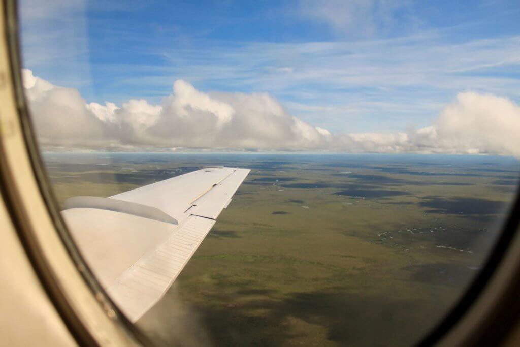 Aerial view of vast expanse of flat green tundra