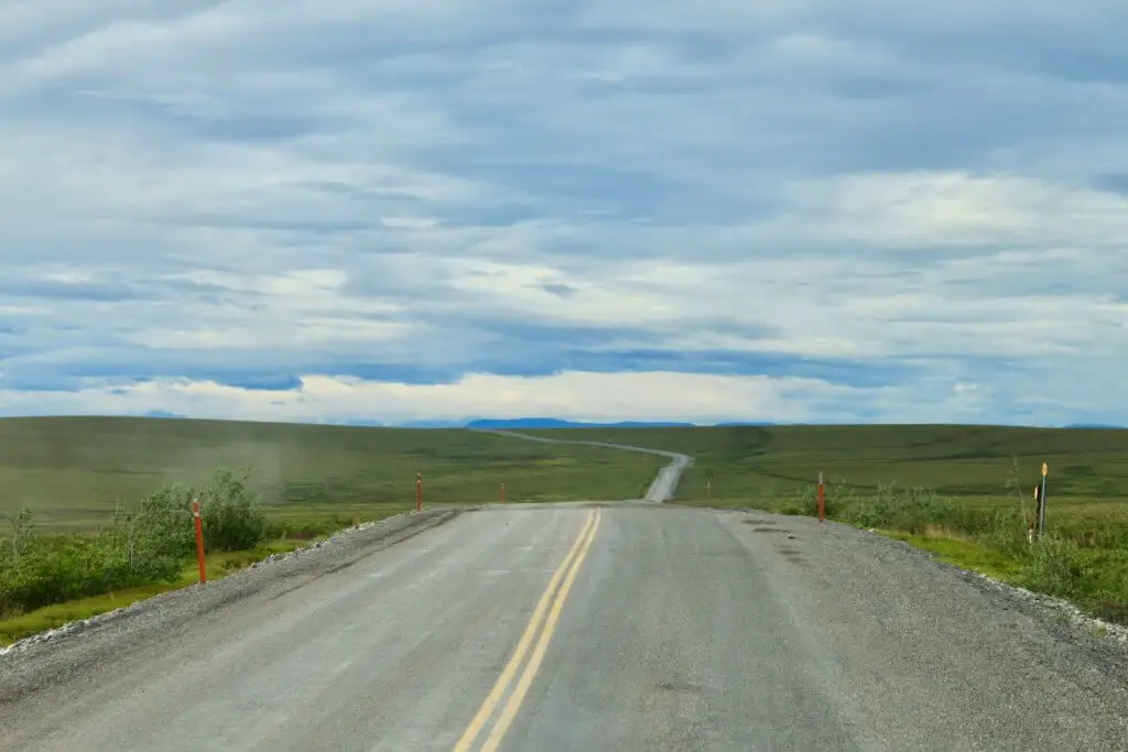 The Dalton Highway in Alaska stretching in the horizon