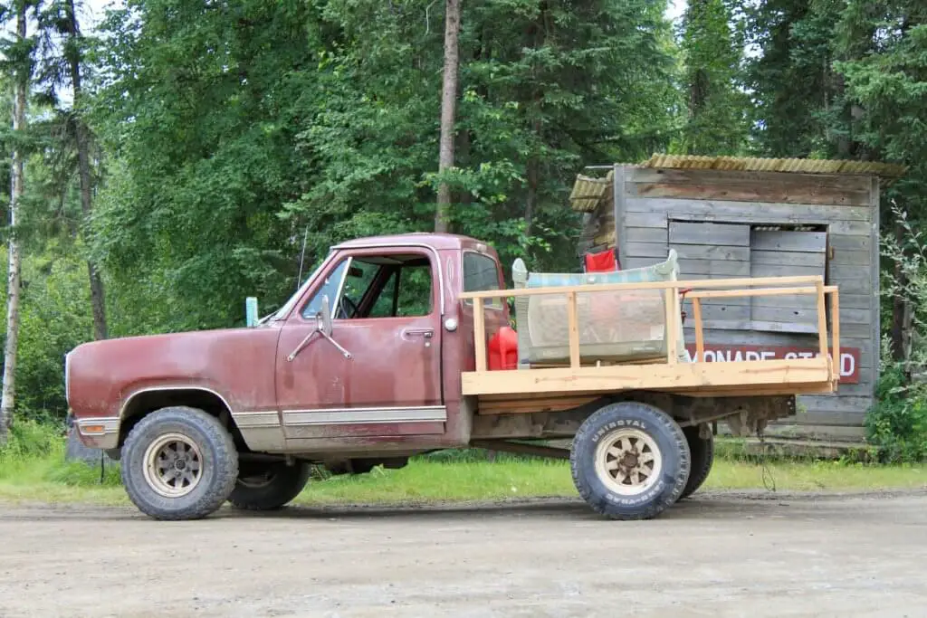 Pickup truck with baby's pack-and-play in the bed.