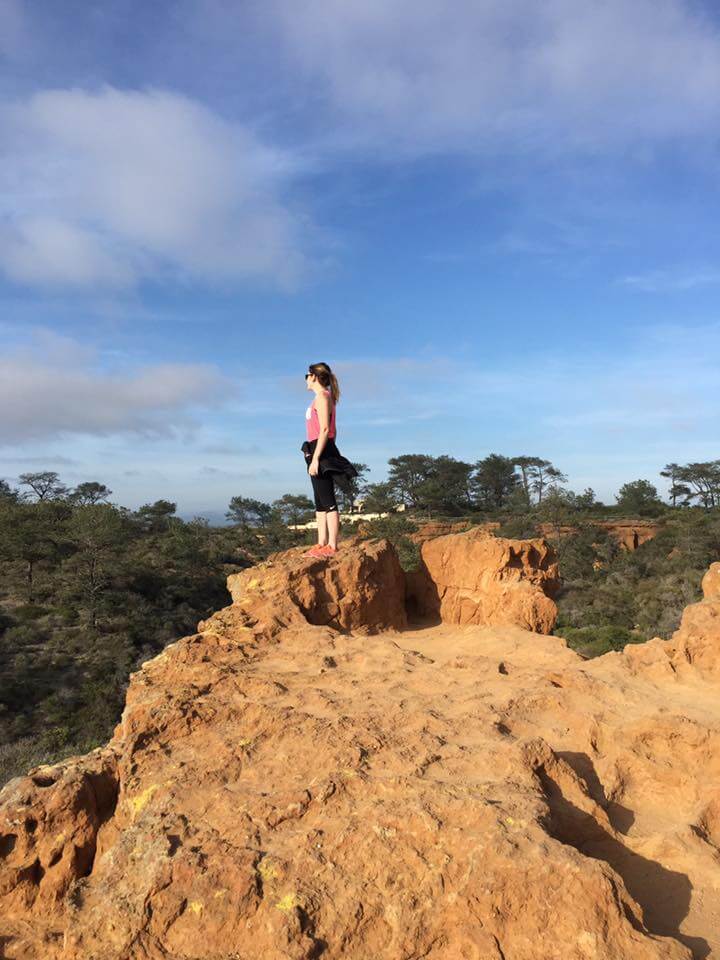 Charlotte staring out over the cliffs