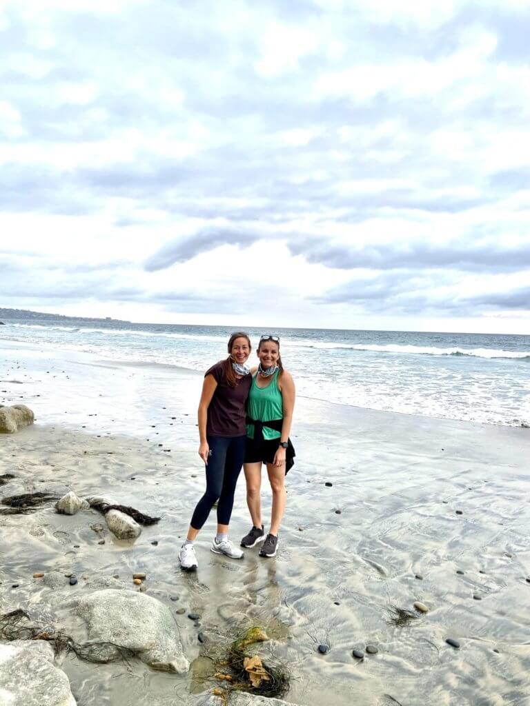 Charlotte and a friend in the sand on the Beach Trail Loop