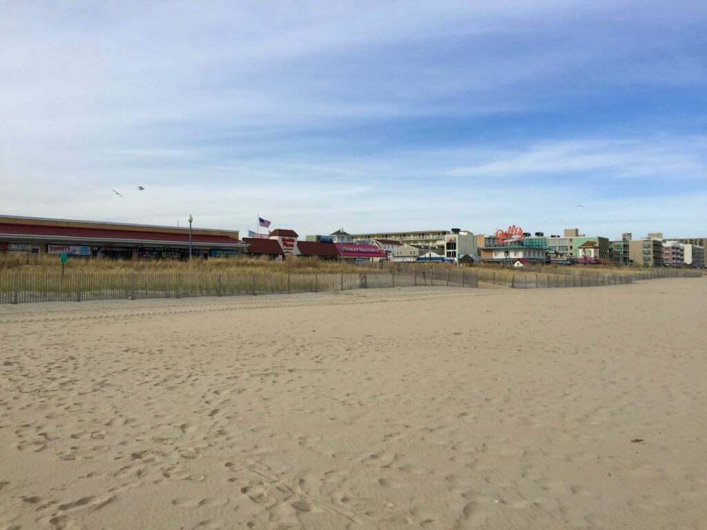 Empty sand in front of the Rehoboth Beach boardwalk during the off-season