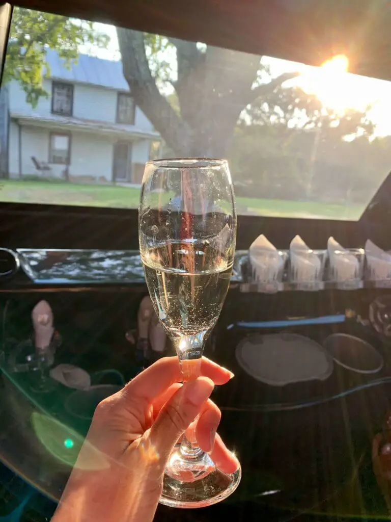 Glass of champagne in the limo