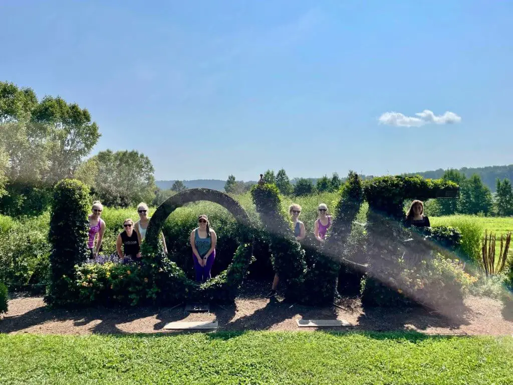 The ladies of our Virginia Wine Country bachelorette weekend posing with shrubs spelling out LOVE