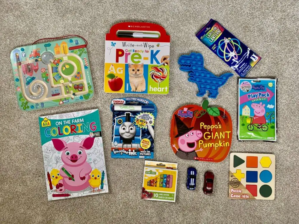 The ultimate toddler road trip kit: crayons, coloring books, toys, puzzles, and books.
