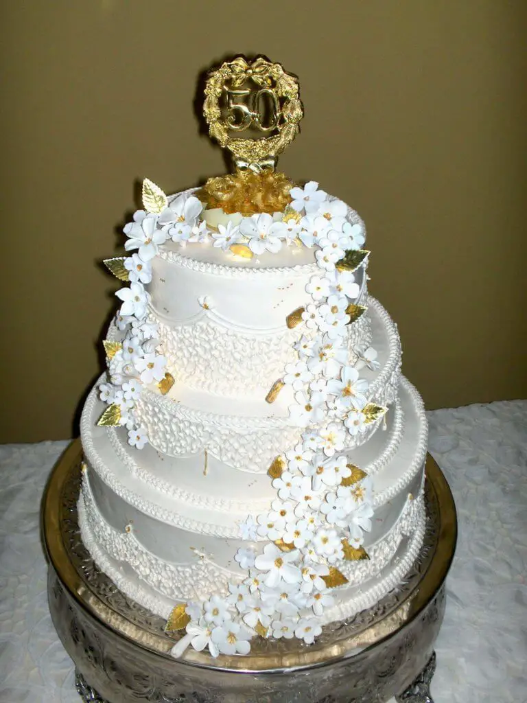 Elaborately decorated white 50th anniversary cake