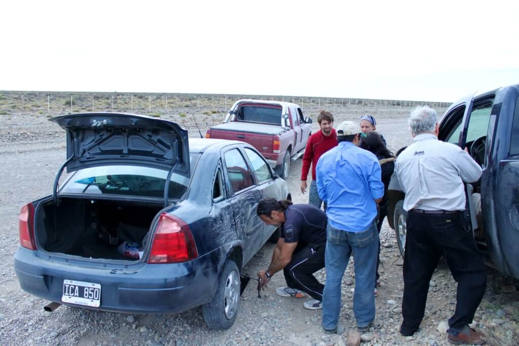 Accident scene with people working on the car