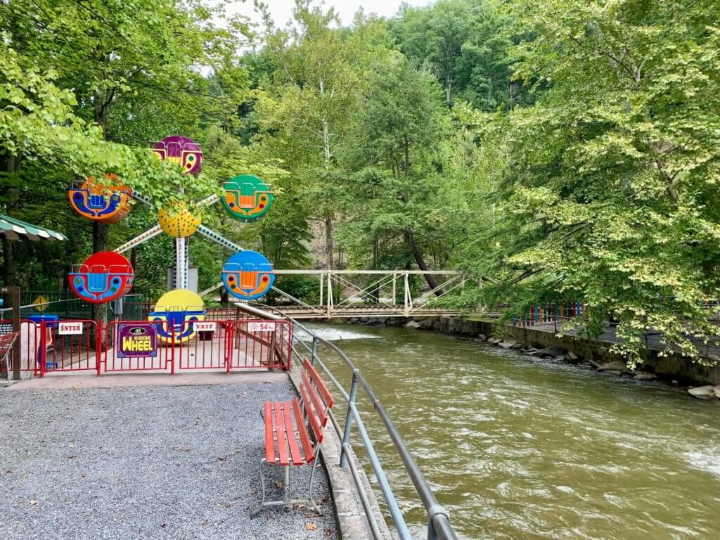 Kiddie ferris wheel sitting alongside the creek