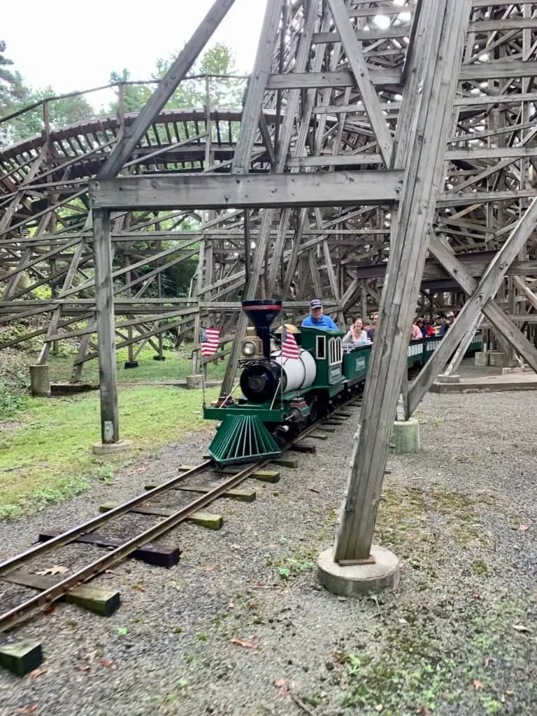 The Pioneer Train emerging from under the Twister wooden roller coaster