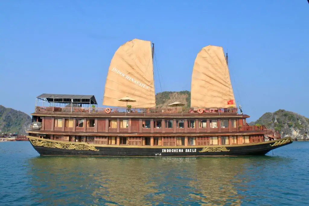 A much fancier wooden Ha Long Bay cruise ship with two big, traditional sails