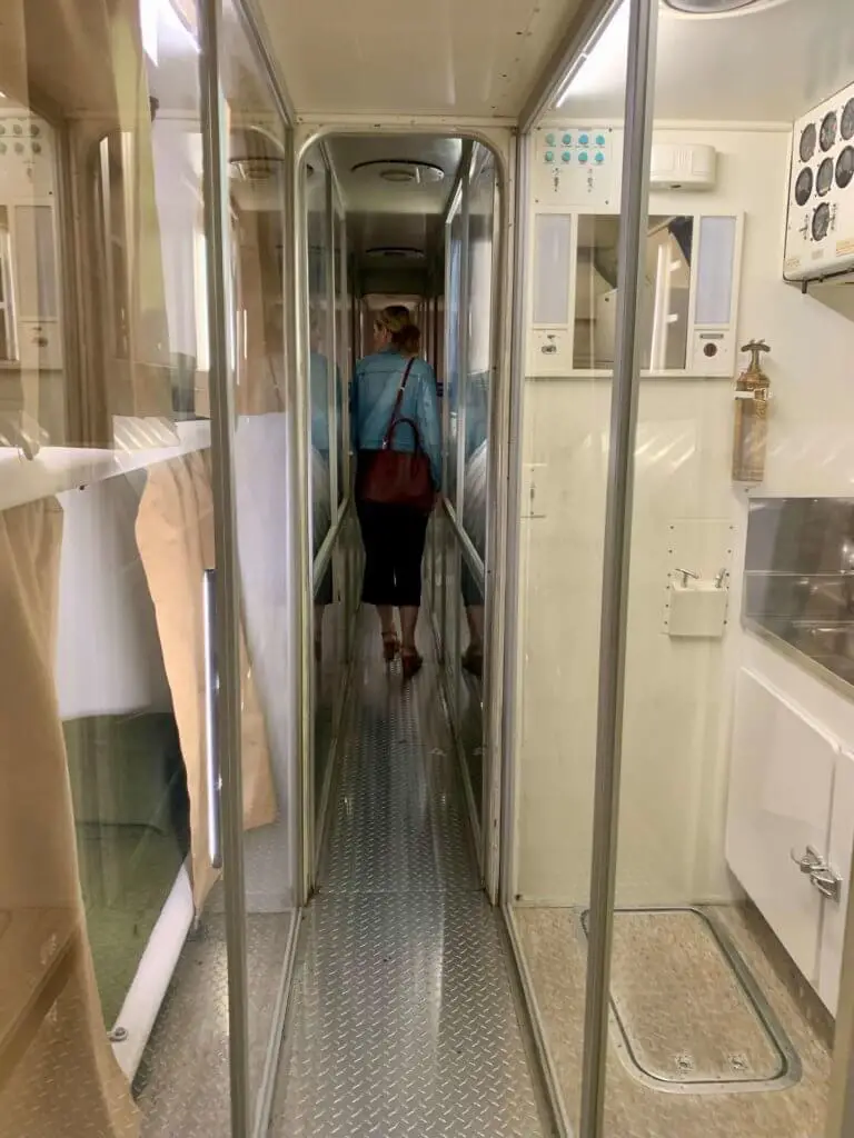 Walking through a retired presidential airplane with a narrow walkway