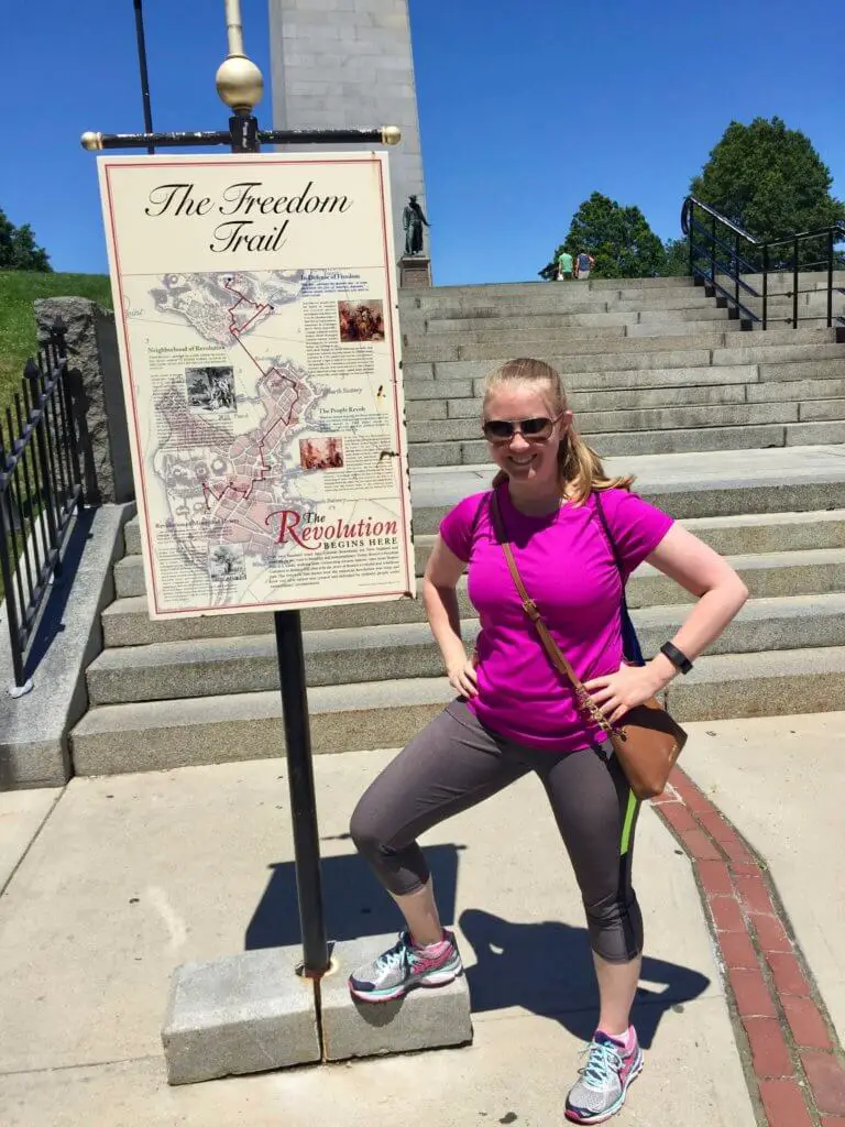 Molly in front of a sign for the Boston Freedom Trail