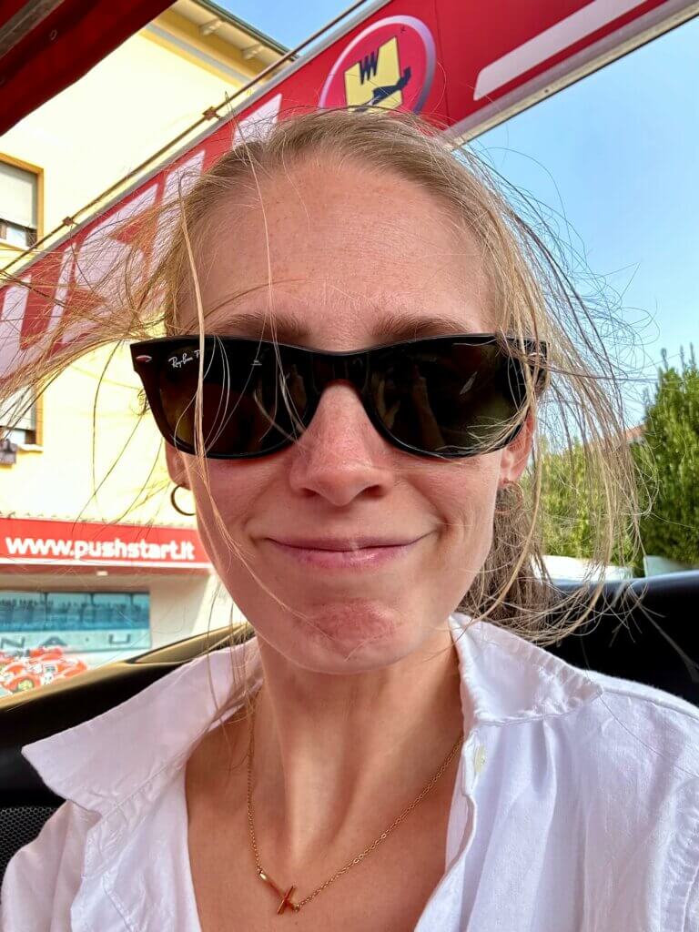 Gwen looking completely disheveled thanks to the wind during their Ferrari drive in Italy.